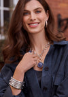 silver jewelry with Tanzanite gemstone on model 