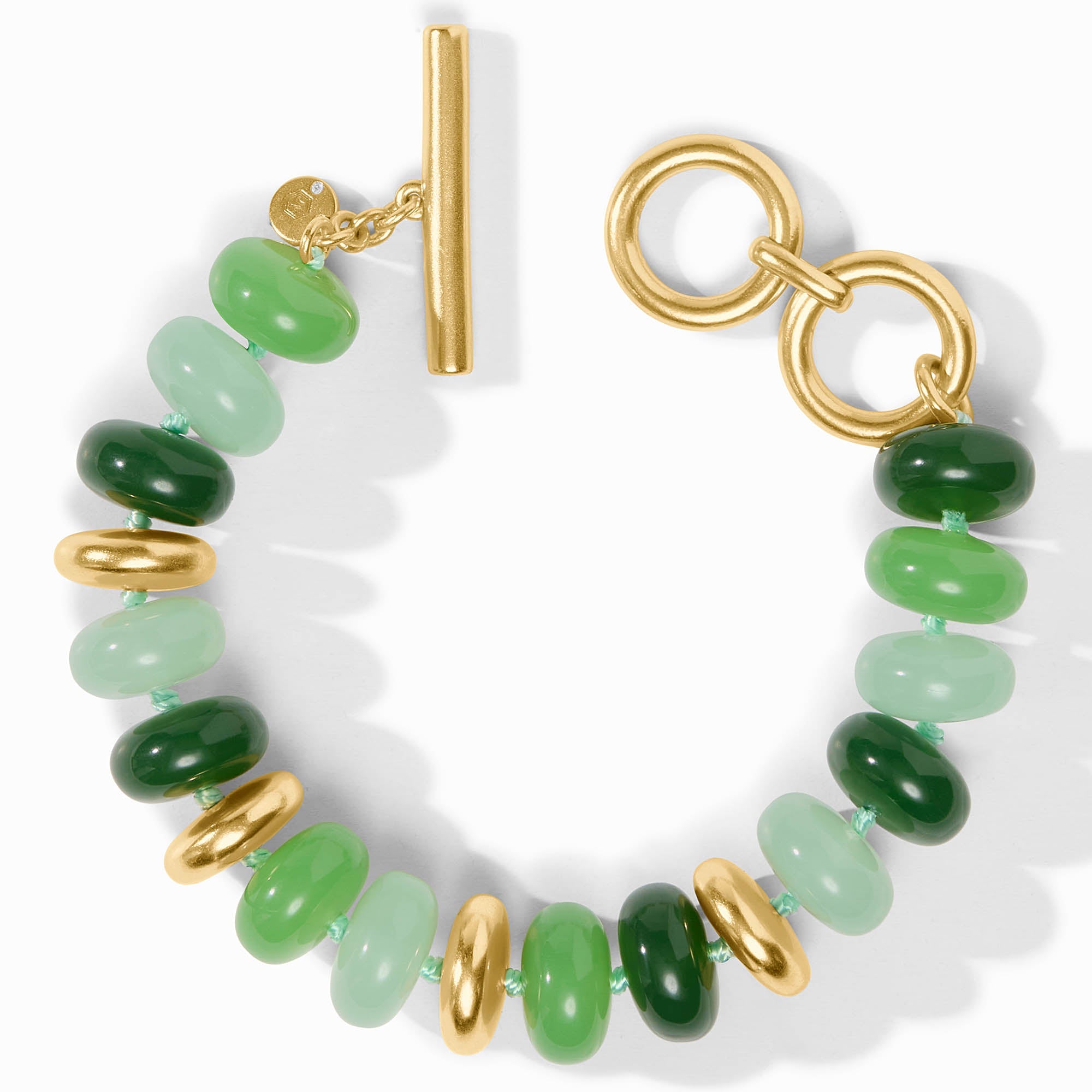 carousel, Bracelet with green beads and gold accents on a white background