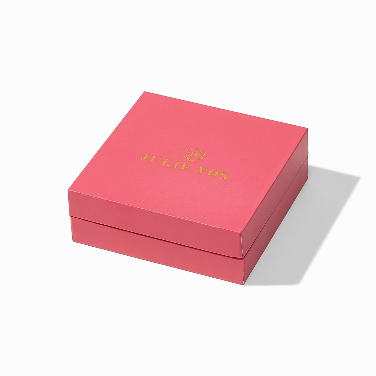 carousel, A square pink gift box with a hinged lid, featuring the brand name 'J'TEE FOR' printed in gold on the top lid, set against a clean white background with a soft shadow.