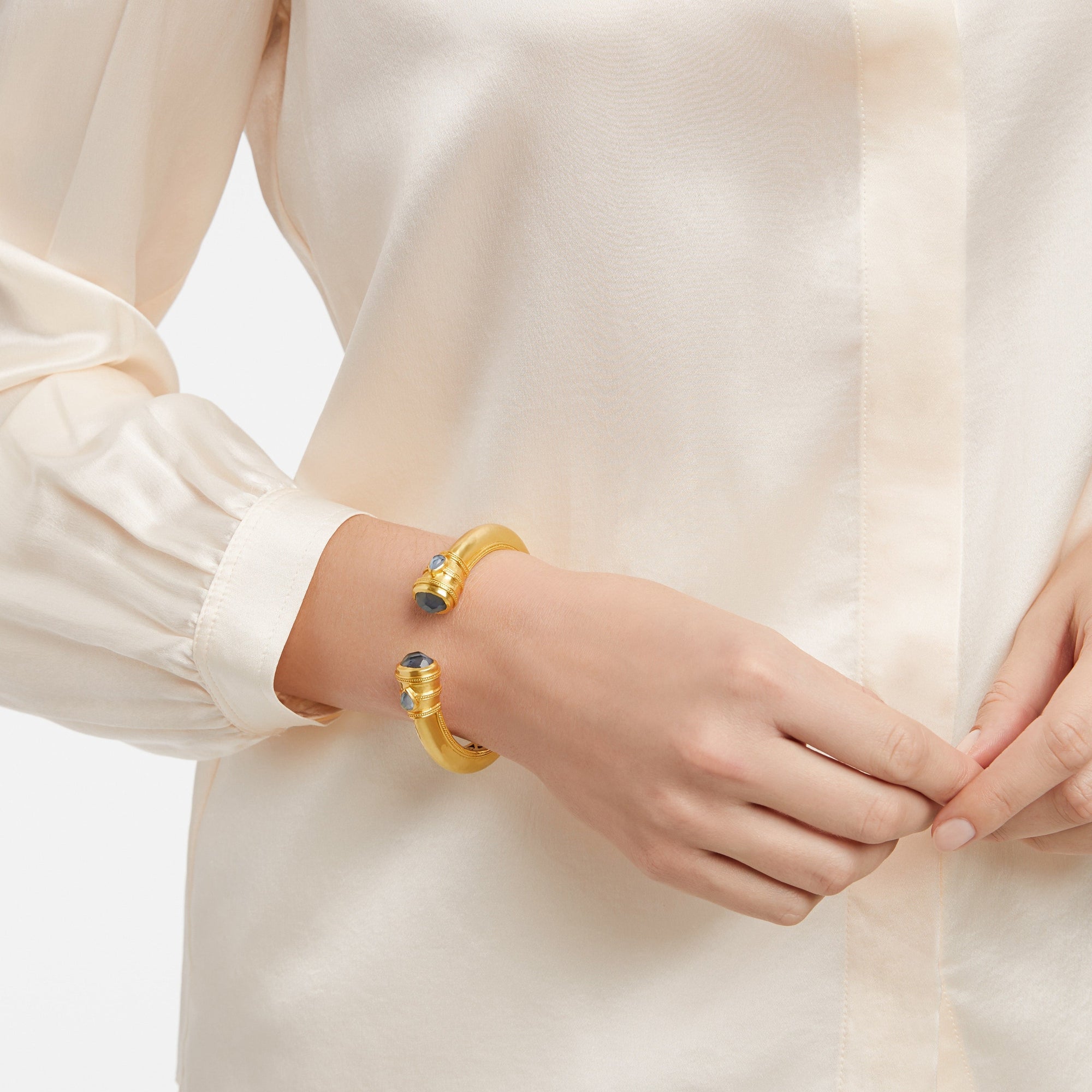 Cassis, a Julie Vos Hinge Cuff bracelet on the wrist of a woman, carousel