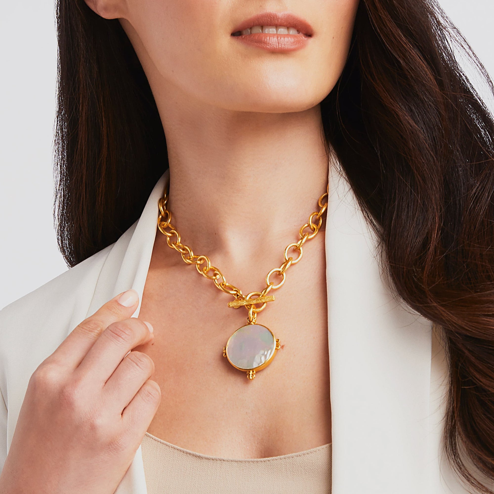 carousel {{ Model wearing Meridian Statement Necklace on Mother of Pearl side }}